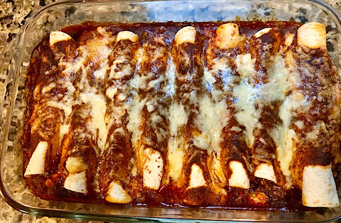 creamy chicken enchiladas with cream cheese, a recipe featured by top US lifestyle blog, More Than Main Street