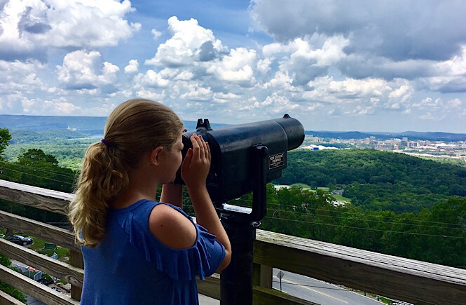 girl looking out from Rock City Tennessee