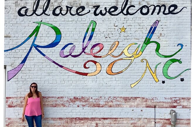 5 Weekend Getaways in NC for Family featured by top NC travel blog, More Than Main Street: All are Welcome mural in Raleigh NC