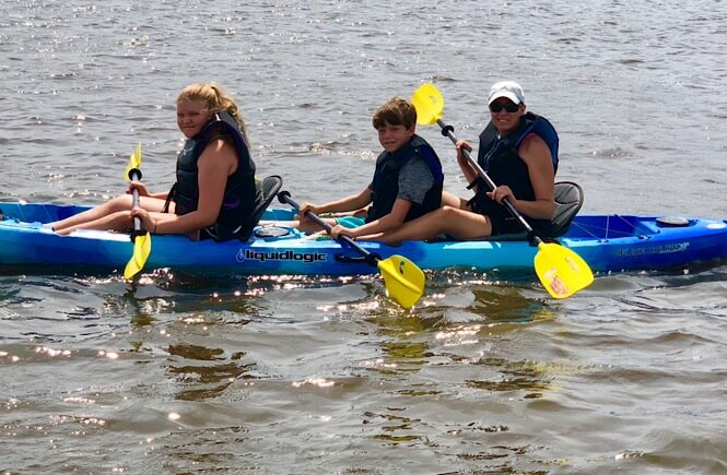 5 Weekend Getaways in NC for Family featured by top NC travel blog, More Than Main Street: Family fun weekend in Wilmington, NC kayaking on the Intracoastal Waterway.