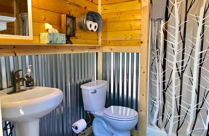 Bryce Canyon Glamping experience featured by top US family travel blog, More Than Main Street: image of 
 bathroom at whispering pines glamping resort