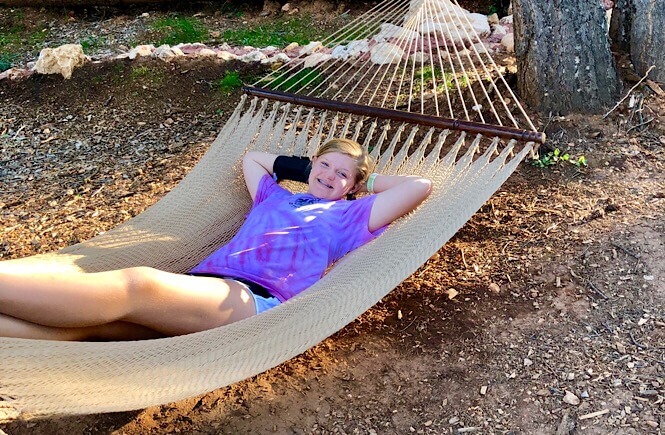 Bryce Canyon Glamping experience featured by top US family travel blog, More Than Main Street: image of Relaxing in our hammock!