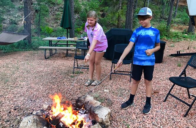 Bryce Canyon Glamping experience featured by top US family travel blog, More Than Main Street: image of 
 Making s'mores at Whispering Pines!