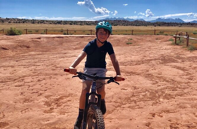 2 Week Utah Arizona road trip featured by top US family travel blog, More Than Main Street: image of Mountain Biking in Moab, Utah!