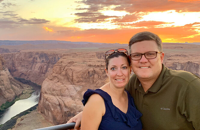 The Best 2 Things To Do in Page Arizona as featured by top US family travel blog, More than Main Street; Couple at Horseshoe Bend in Page Arizona.
