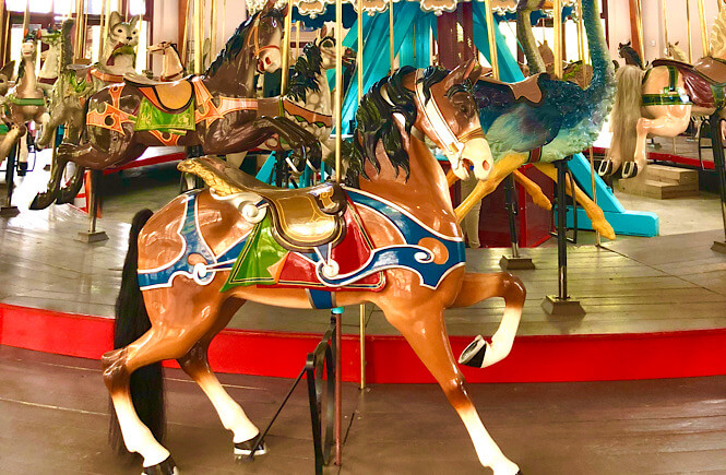 Top 10 Fun Things to Do in Raleigh with Kids tips featured by top North Carolina travel blog More than Main Street: Carousel at Pullen Park.