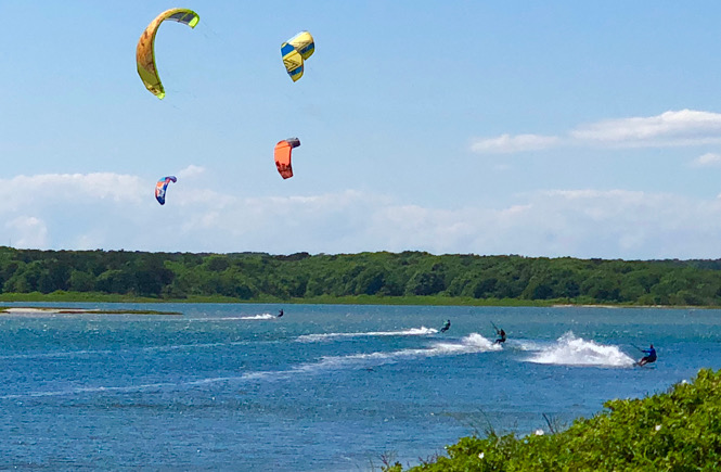 The perfect itinerary for a day trip to Martha's Vineyard from Falmouth MA featured by US family travel blog, More than Main Street; kite surfing.