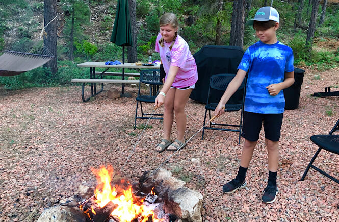 Top 10 Stay At Home Adventures for Your Family featured by top lifestyle and US travel blog, More than Main Street; smores by the campfire!