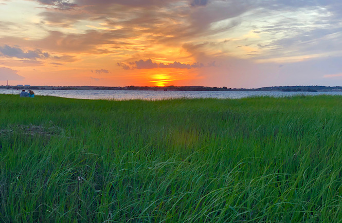 Sunset over the Cape Fear River at Fort Fisher, NC. Photo by US travel blog More than Main Street.