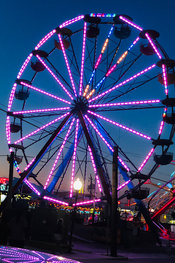 Top 10 best things to do in Carolina Beach and Kure Beach NC featured by top US travel blog, More than Main Street: Ferris wheel on Carolina Beach boardwalk.