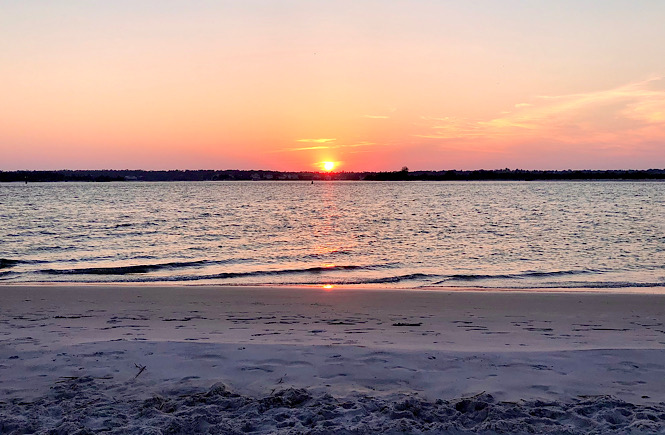 The South End of Wrightsville Beach is  is one of the Top 5 Best Places to Watch the Sunset in Wilmington NC featured by top US travel blog, More than Main Street.