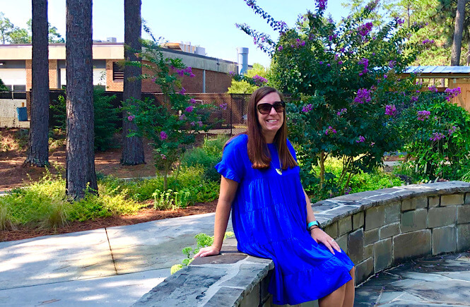 Top 10 Best Things to Do in Pinehurst North Carolina on Your Next Family Vacation featured by top US travel blog, More than Main Street: image of girl at Sandhills Community College gardens.