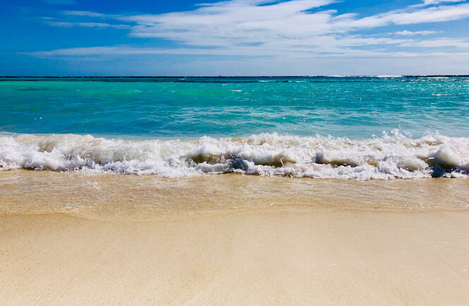 The complete list of things to take to the beach featured by top US travel blog, More than Main Street: beautiful beach in Aruba.