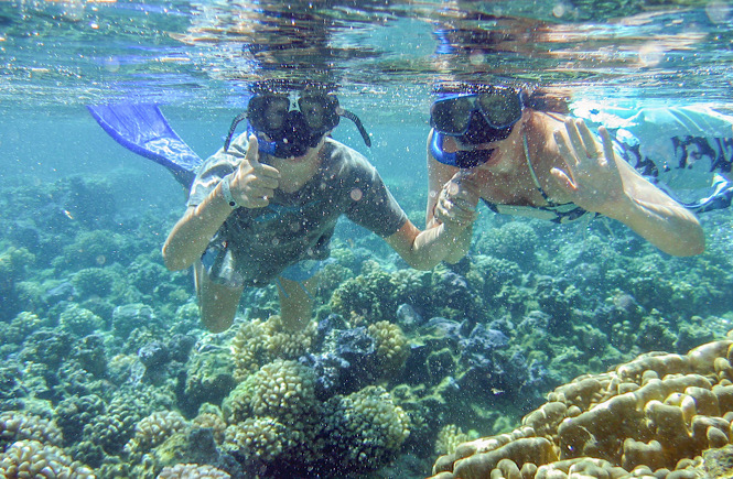 two people snorkeling in the Bahamas.