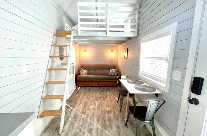 Living room and dinette at River and Twine Tiny house hotel.