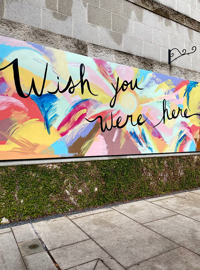 Wish you were here mural at North Hills in Raleigh North Carolina.