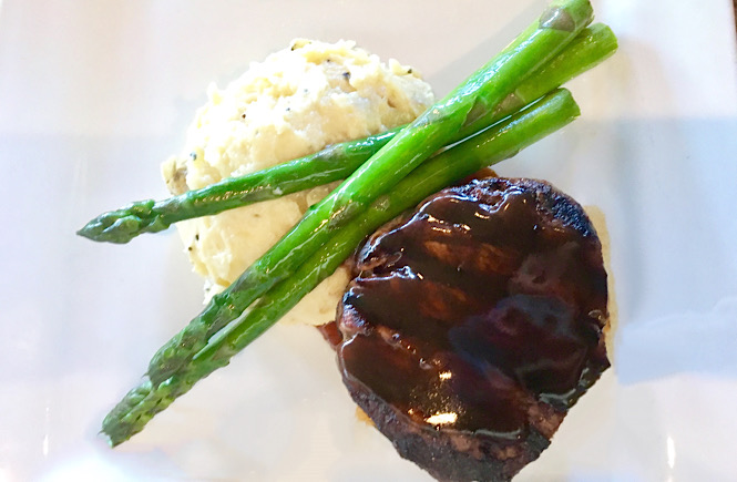 Steak, mashed potatoes and asparagus from Bridge Tender in Wilmington NC featured by top NC travel blog, More than Main Street.