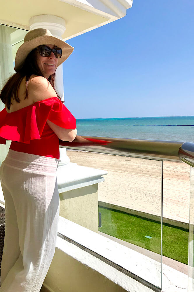 Girl on the balcony of the oceanfront room in the Nizuc section of the Moon Palace.