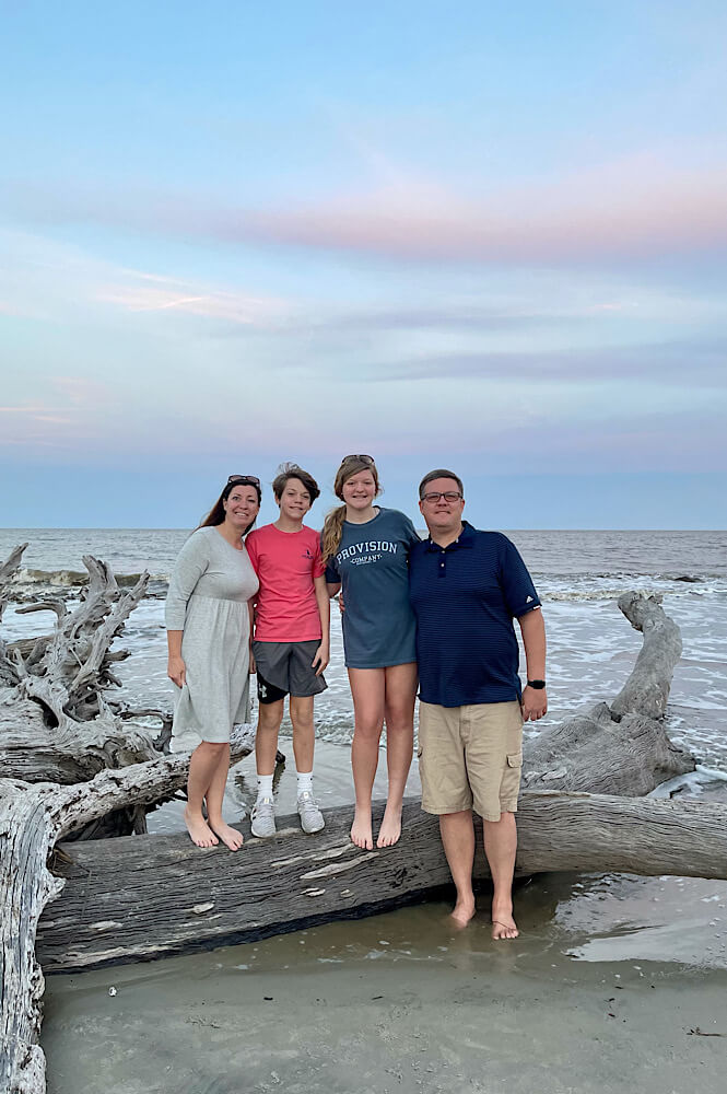 Family at Driftwood Beach on Jekyll Island Georgia.