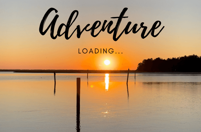 Adventure loading with a sunrise over the water.