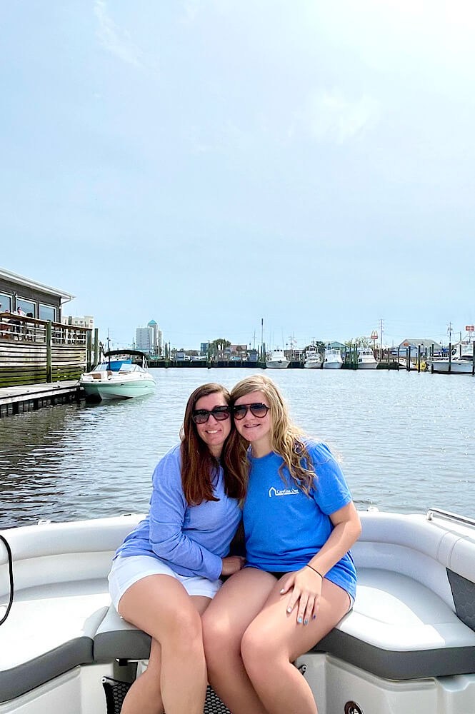 two girls on a boat at Carolina Beach NC