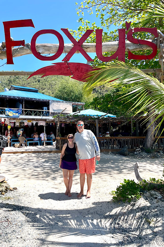 couple standing in front of Foxy's on Jost Van Dyke in the British Virgin Islands