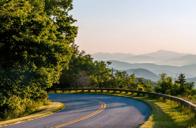 road curving in the mountains- courtesy of canva