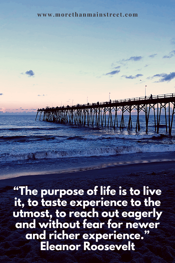 purpose of life quote with a pier at sunset background