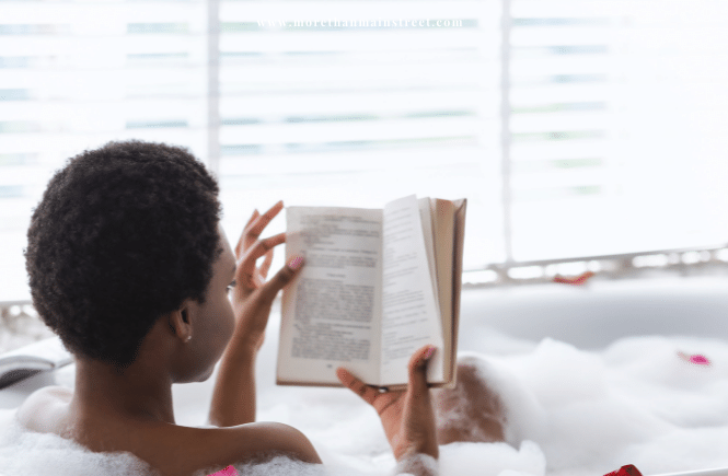 woman reading in a bubble bath