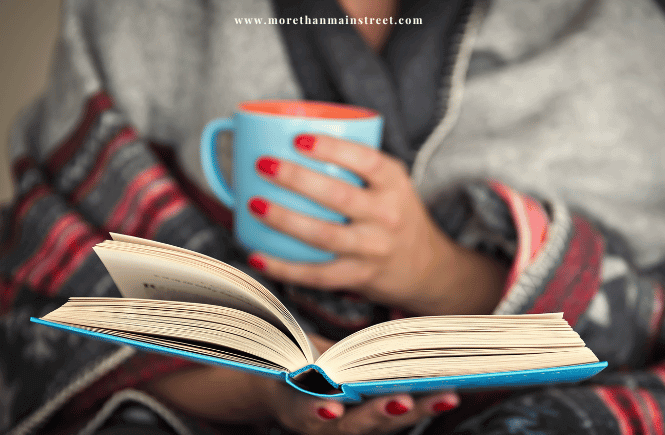 Self care sunday quotes and captions- image of a female hands holding a coffee mug and a book