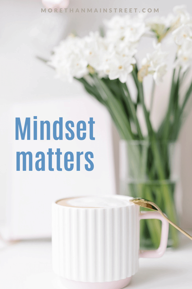 Mindset matters sayings with image of a white coffee cup and clear vase with white flowers 