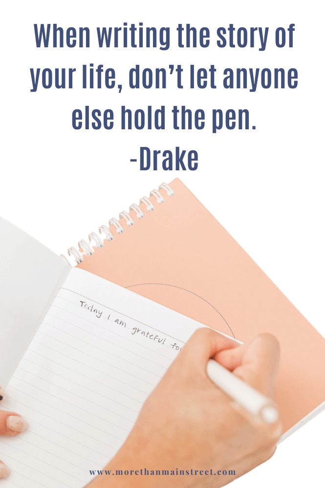 Motivational monday quotes by Drake about writing your own story- image over someone holding a pen and writing