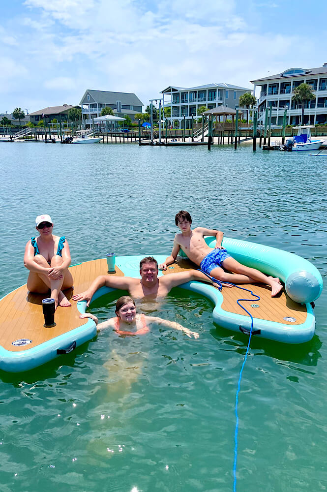 family floating on a Bote floating couch in Wrightsville Beach NC