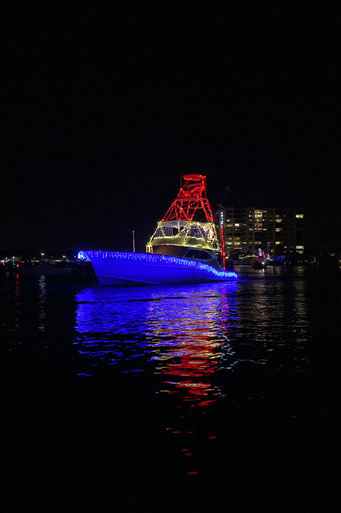 boat decorated in red, white, and blue for the Flotilla boat parade in Wrightsville Beach NC