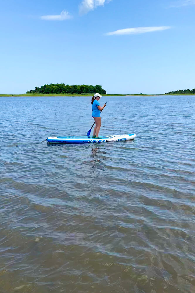 girl paddle boarding