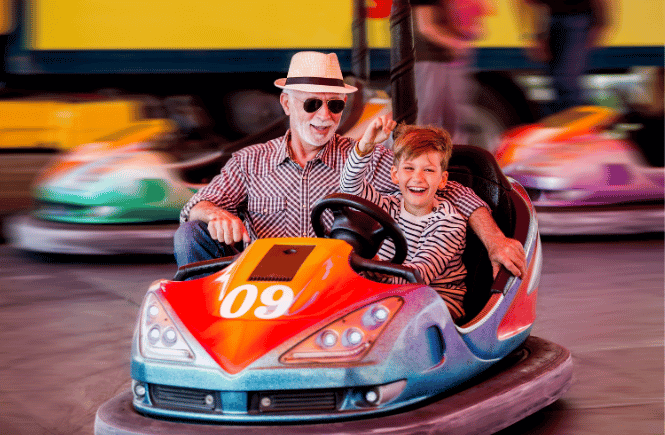 grandpa and grandson in bumper cars