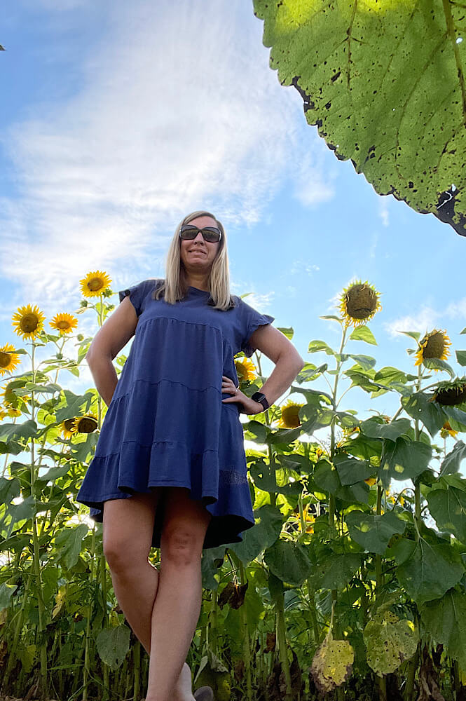 Girl in the summer at the sunflower fields at Dix Park in Raleigh NC