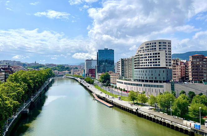 City of Bilbao Spain- view from a bridge looking at the river and the city