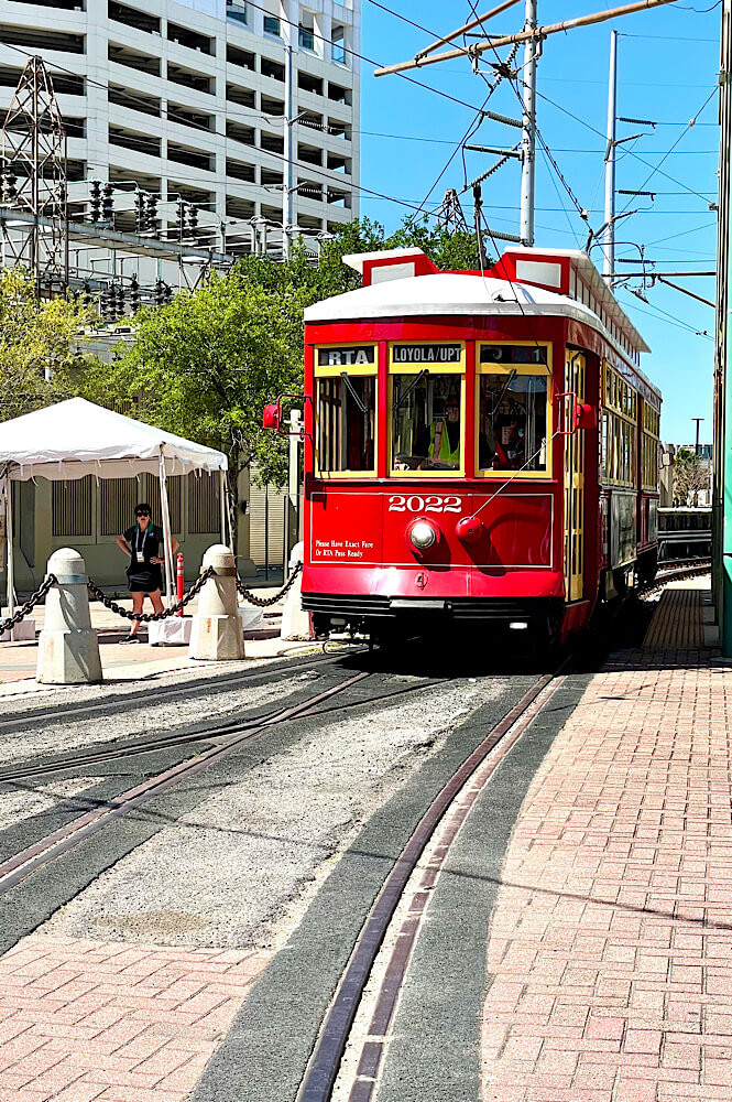 Red trolley on the city streets on New Orleans