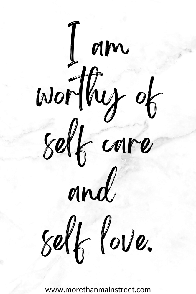 Self care affirmation that reads "I am worthy of self care and self love." with a black and white marbled background.