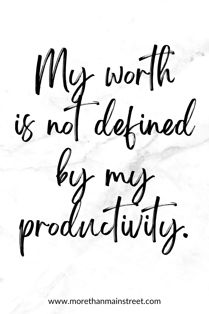 Self-care affirmation for moms that reads "My worth is not defined by my productivity" with a black and white marbled background.