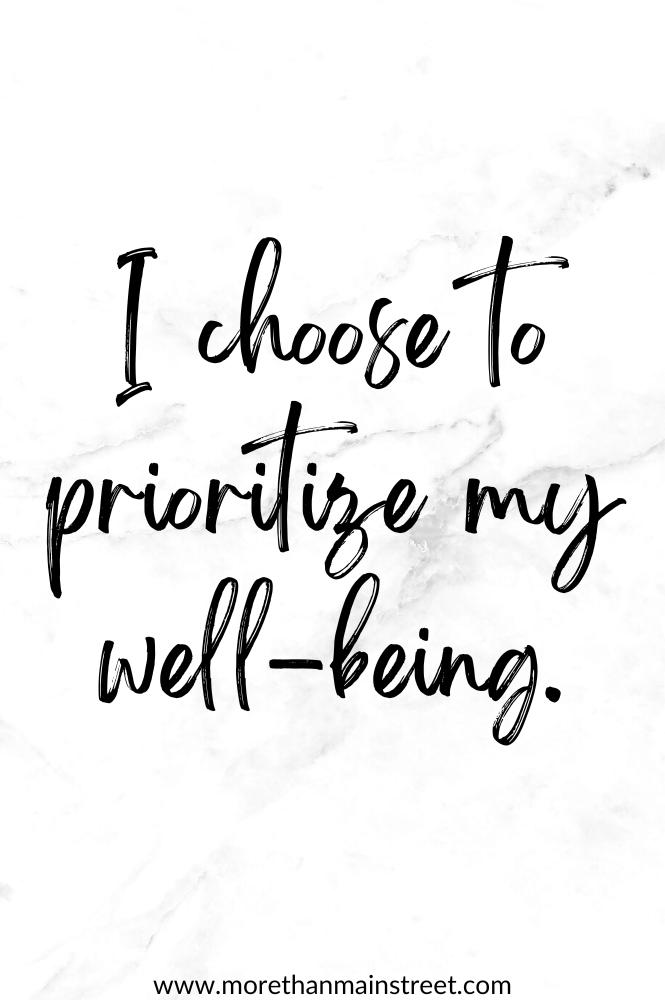 Self care affirmation that reads "I choose to prioritize my well-being." with a black and white marbled background.
