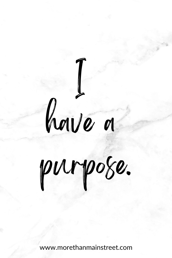 Self-care affirmation that reads "I have a purpose" with a black and white marbled background.
