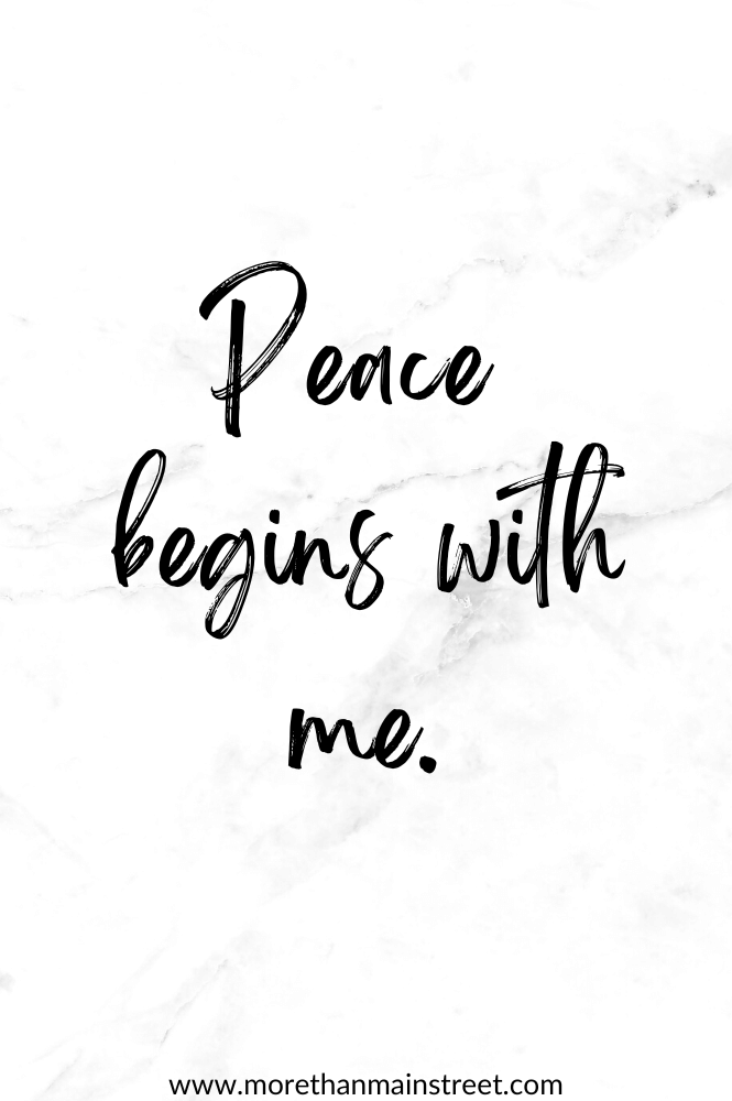 White/ black marbled background with the mantra Peace begins with me.