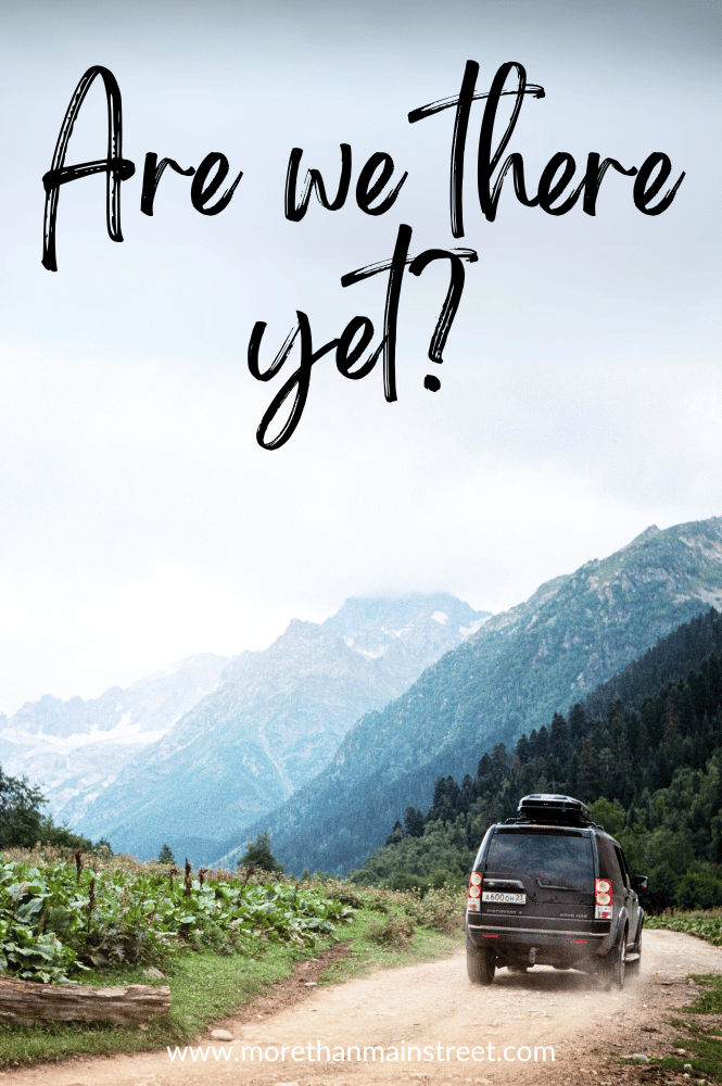 Image of a van on a dirt road in the mountains with caption "Are we there yet"