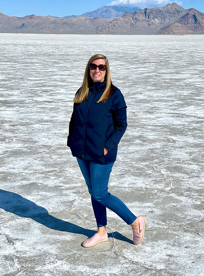 Julie at Bonneville Salt Flats in Utah sharing my personal story about adopting a slower lifestyle
