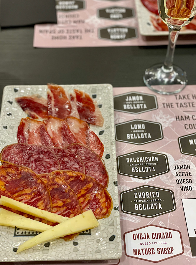 Learning about ham in Madrid Spain on a food tour