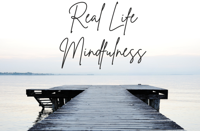 A zen gray and white scene of a dock leading over water with text that reads real life mindfulness