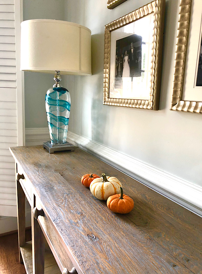 Three mini pumpkins as a fun fall decor and easy way to romanticize the season.