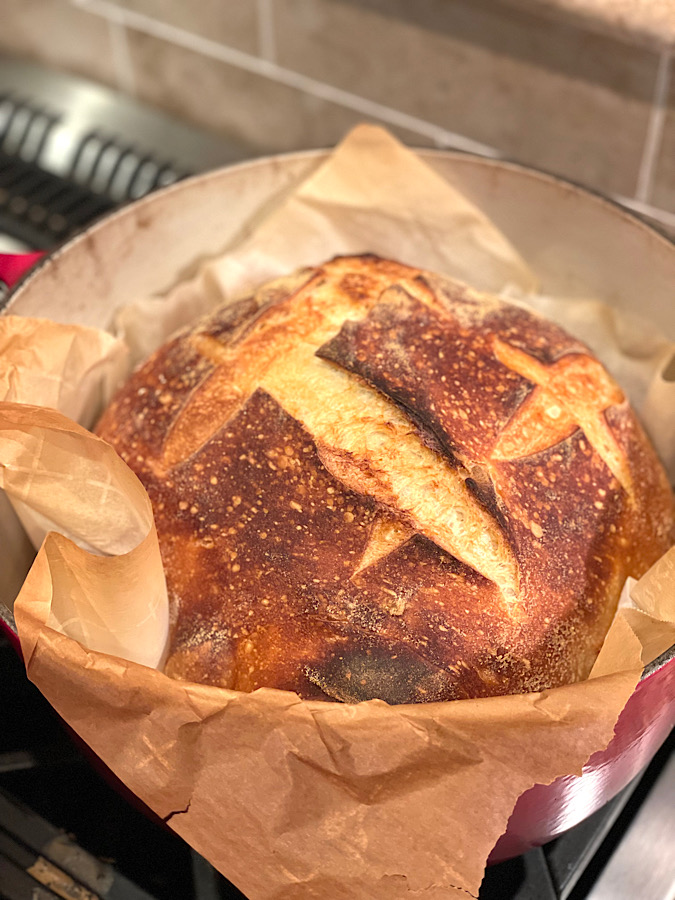 Baking sourdough has become one of the most popular hobbies for women recently. A freshly baked loaf of round sourdough straight out of the oven!